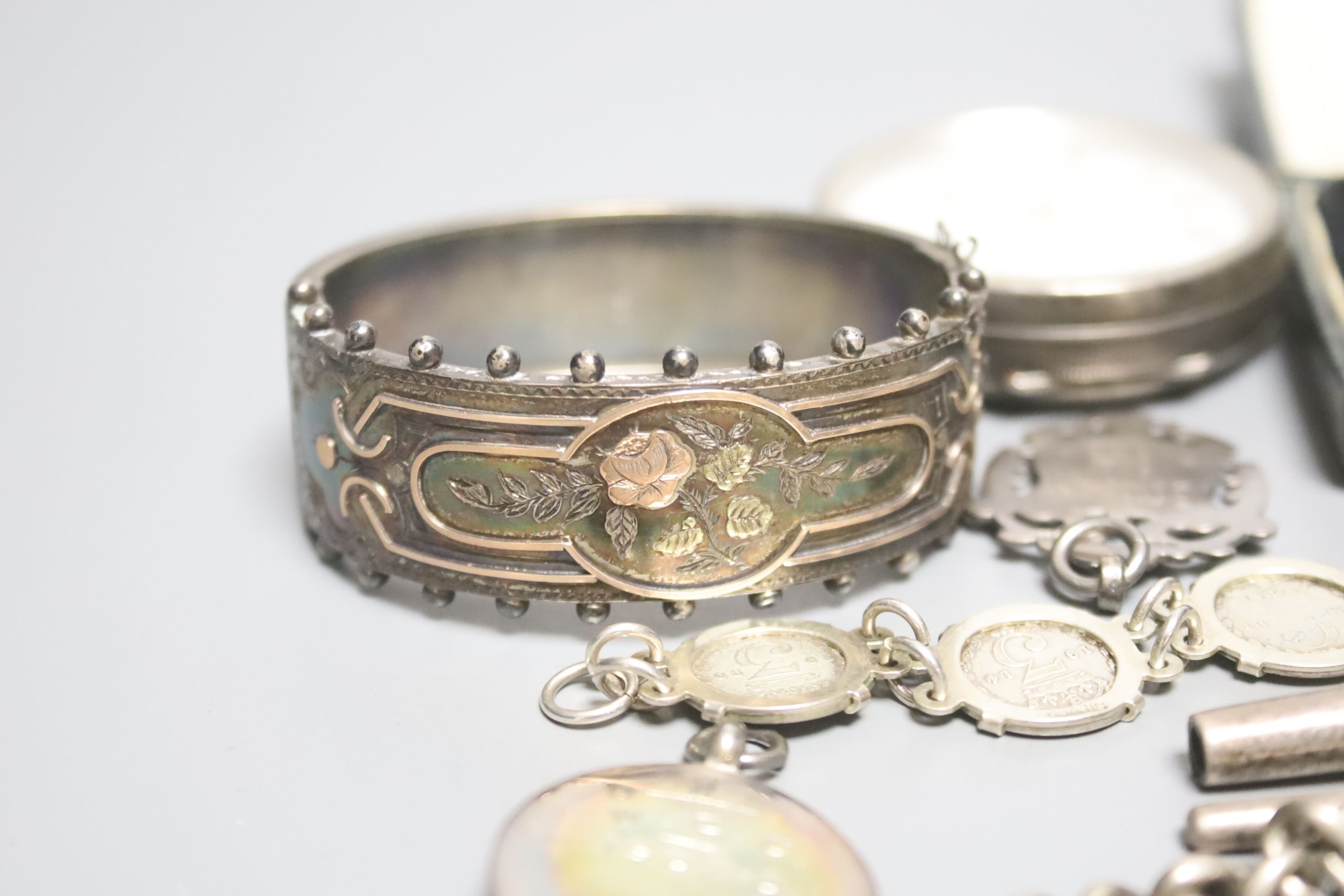 Mixed items including silver medallions, Victorian silver and yellow metal hinged bangle and a Mordan & Co pencil